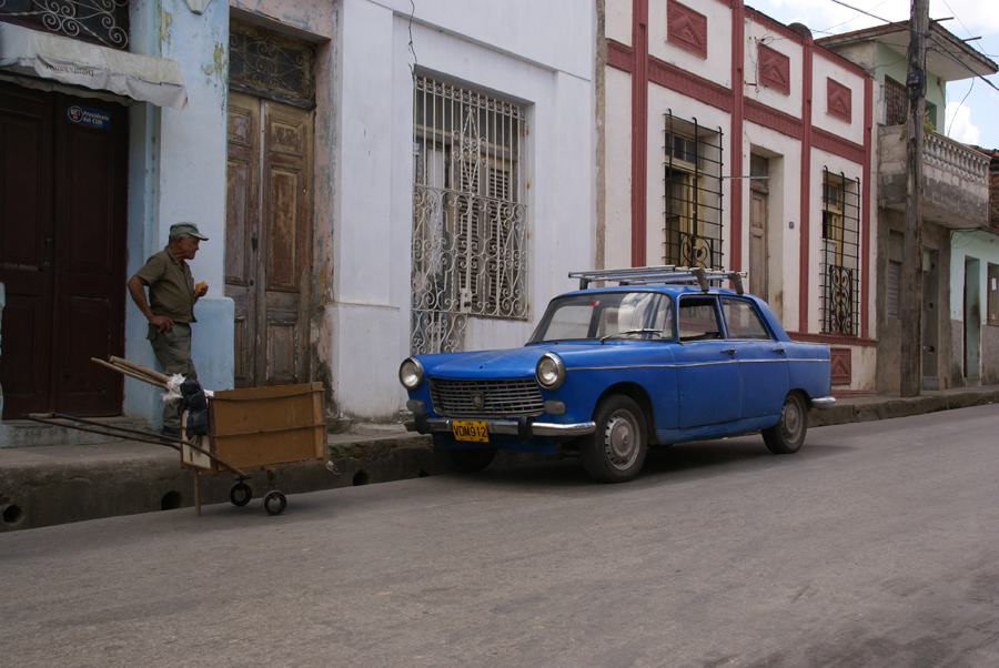 Old blue Peugeot, road sweeper and barrow, Santa Clara, Cuba